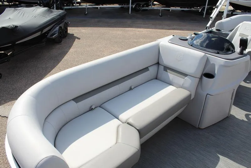 Slide: The Image of 2023 Godfrey Sweetwater 2286 C Sport Tube boat interior with plush seating. - 11