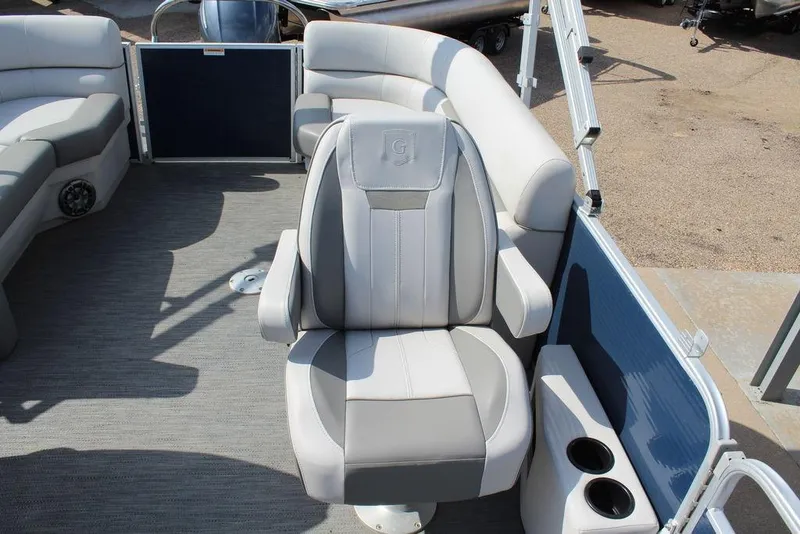 Slide: The Image of 2023 Godfrey Sweetwater 2286 C Sport Tube boat interior with comfortable seating and cup holders. - 12