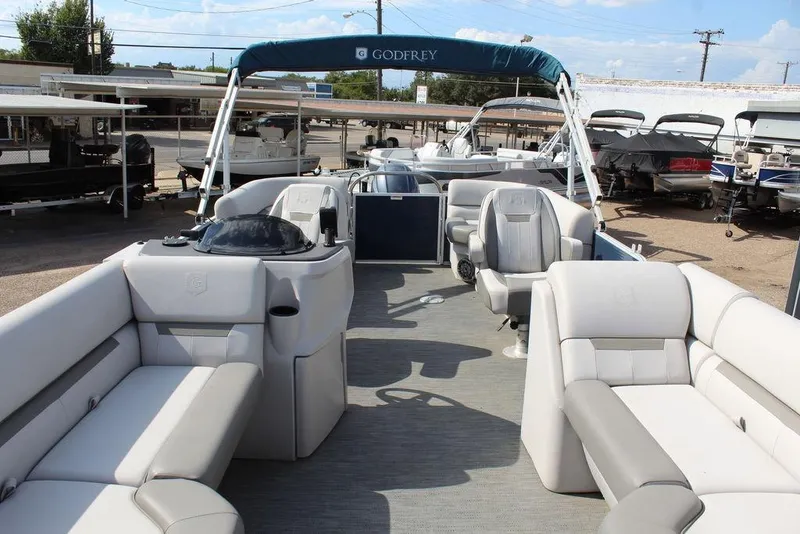 Slide: The Image of 2023 Godfrey Sweetwater 2286 C Sport Tube pontoon boat with spacious seating and canopy. - 13