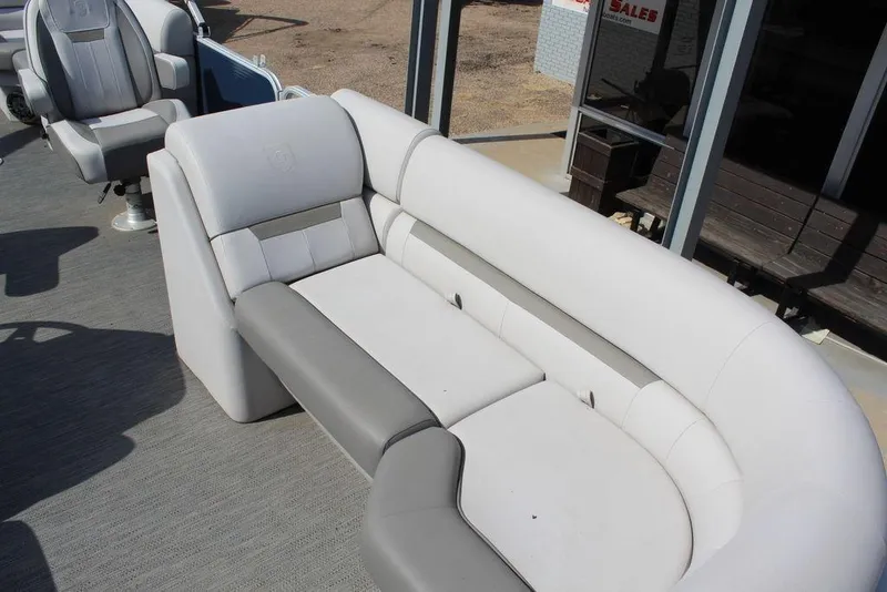 Slide: The Image of 2023 Godfrey Sweetwater 2286 C Sport Tube boat interior with plush seating. - 15
