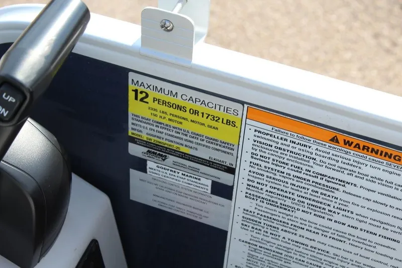 Slide: The Image of 2023 Godfrey Sweetwater 2286 C Sport Tube capacity warning label, 12 persons or 1732 lbs. - 18