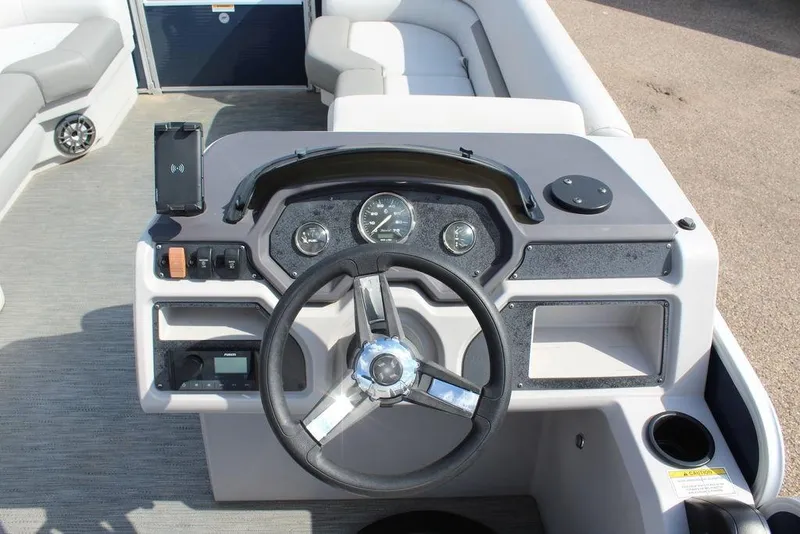 Slide: The Image of 2023 Godfrey Sweetwater 2286 C Sport Tube dashboard with steering wheel and controls. - 20