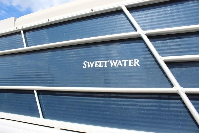 Slide: The Image of 2023 Godfrey Sweetwater 2286 C Sport Tube, blue exterior with white accents. - 22