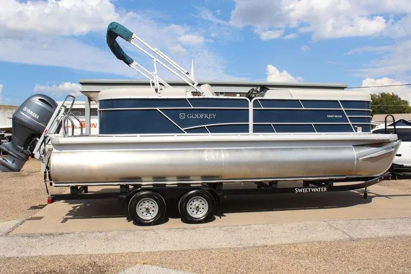 Slide: The Image of 2023 Godfrey Sweetwater 2286 C Sport Tube pontoon boat on trailer, side view. - 3