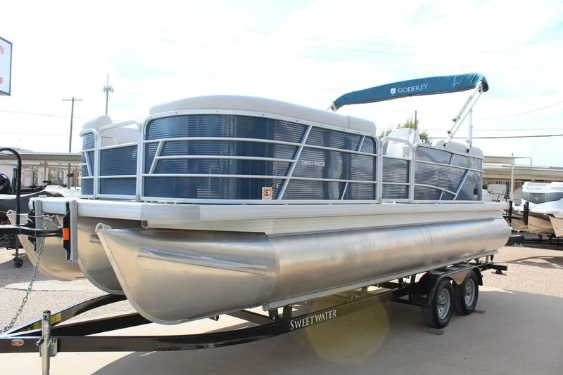 Slide: The Image of 2023 Godfrey Sweetwater 2286 C Sport Tube pontoon boat on trailer. - 7