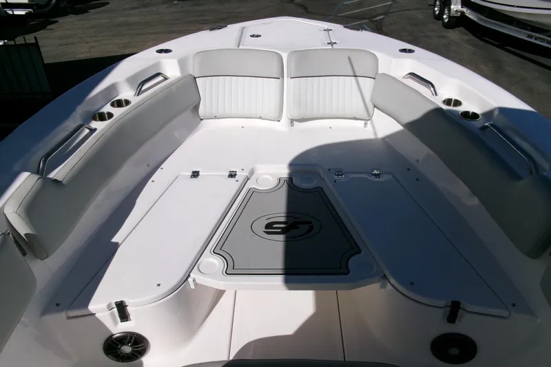 Slide: The Image of 2024 Sea Fox 248 Commander boat interior with cushioned seating and cup holders. - 10