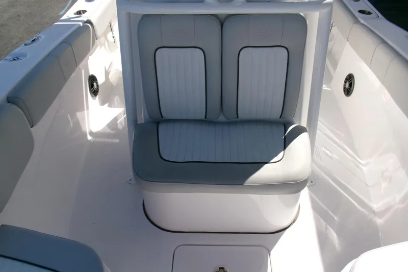 Slide: The Image of 2024 Sea Fox 248 Commander boat seating area with cushioned seats and sleek design. - 13