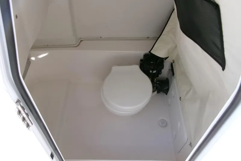 Slide: The Image of 2024 Sea Fox 248 Commander boat interior with compact marine toilet. - 15