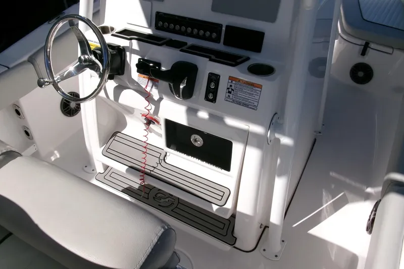 Slide: The Image of 2024 Sea Fox 248 Commander helm with steering wheel and control panel. - 17