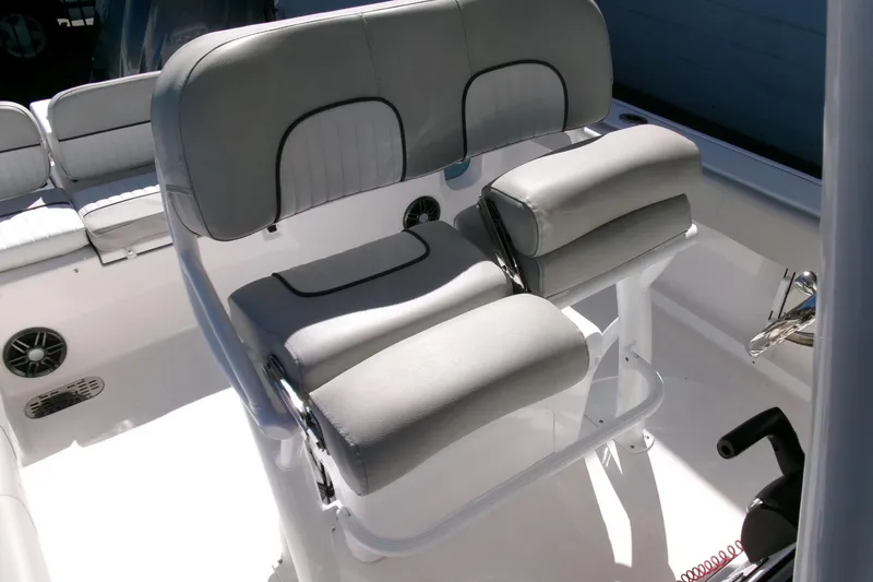 Slide: The Image of 2024 Sea Fox 248 Commander boat seating with cushioned helm chairs. - 23
