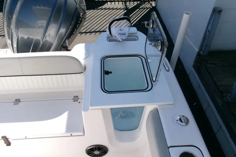 Slide: The Image of 2024 Sea Fox 248 Commander boat with open storage compartment and seating area. - 30