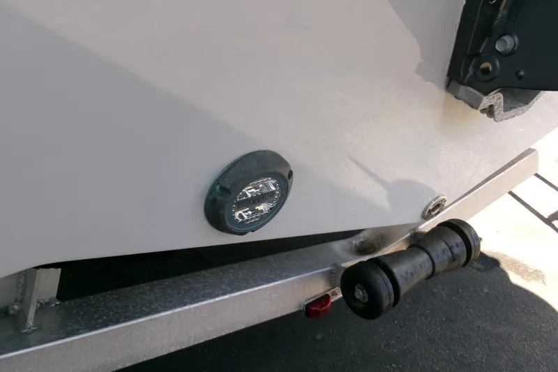 Slide: The Image of 2024 Sea Fox 248 Commander boat detail with trailer roller and light. - 34