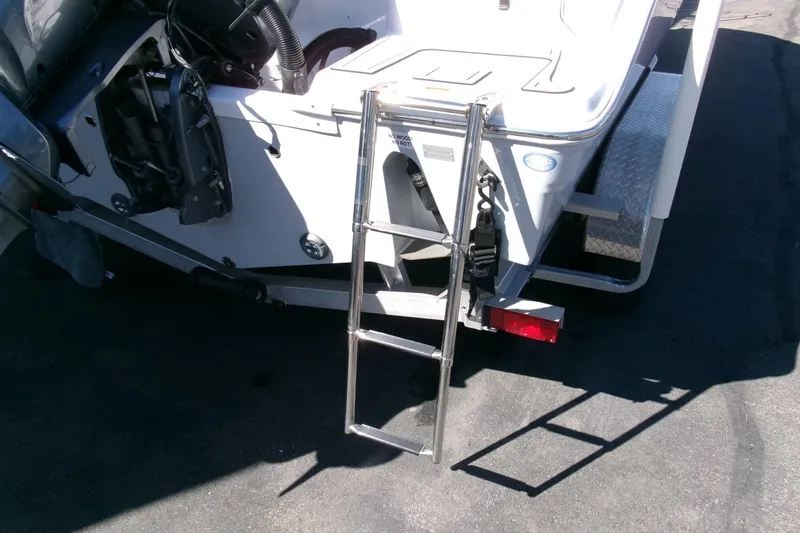 Slide: The Image of 2024 Sea Fox 248 Commander boat with ladder and trailer detail. - 35