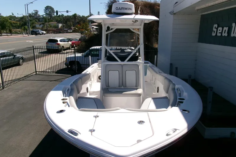 Slide: The Image of 2024 Sea Fox 248 Commander boat with Garmin equipment, parked outdoors. - 37