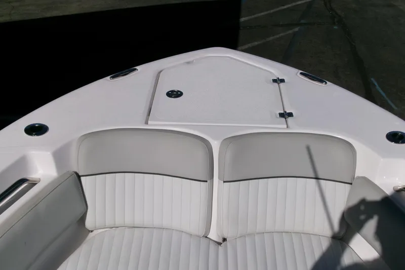 Slide: The Image of 2024 Sea Fox 248 Commander boat bow with white cushioned seating. - 4