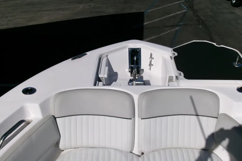 Slide: The Image of 2024 Sea Fox 248 Commander boat interior with white seating and anchor system. - 5