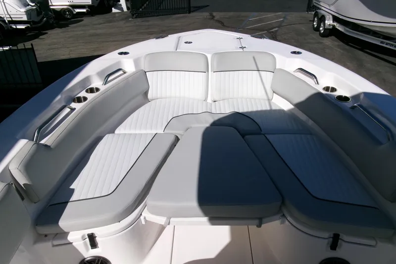Slide: The Image of 2024 Sea Fox 248 Commander boat interior with cushioned seating and cup holders. - 7