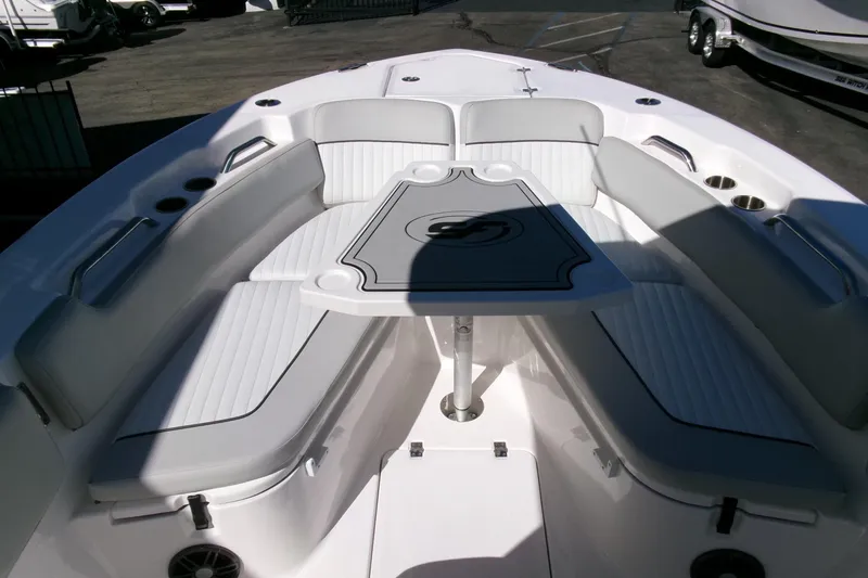 Slide: The Image of 2024 Sea Fox 248 Commander boat interior with cushioned seating and table. - 9