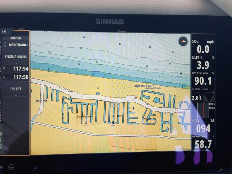 Slide: The Image of Simrad navigation system on a Saxdor 400 GTO boat, displaying a map of Highland Beach. - 23