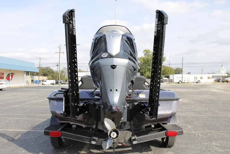Slide: The Image of 2026 Skeeter ZXE20 boat with powerful outboard motor in a parking lot. - 11