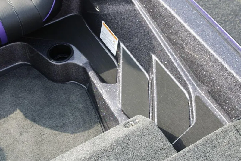 Slide: The Image of Interior of 2026 Skeeter ZXE20 boat, featuring carpeted flooring and storage compartments. - 16