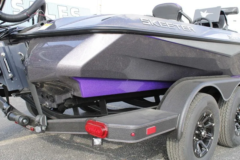 Slide: The Image of 2026 Skeeter ZXE20 boat on trailer, featuring sleek design and vibrant purple accents. - 30