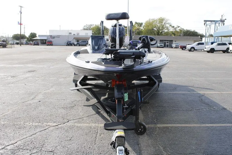 Slide: The Image of 2026 Skeeter ZXE20 boat on trailer in parking lot, front view. - 4