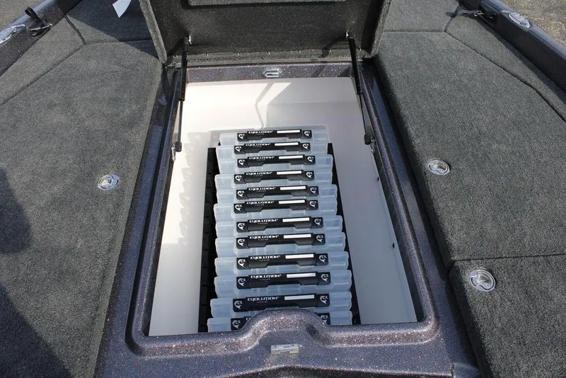 Slide: The Image of Storage compartment of 2026 Skeeter ZXE20 boat with organized tackle boxes. - 8