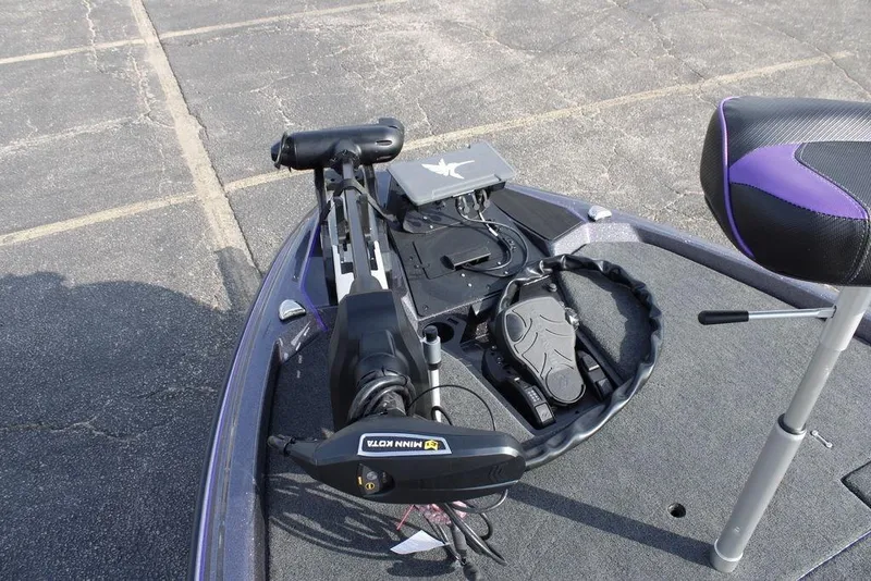 Slide: The Image of 2026 Skeeter ZXE20 boat deck with Minn Kota trolling motor and control panel. - 9