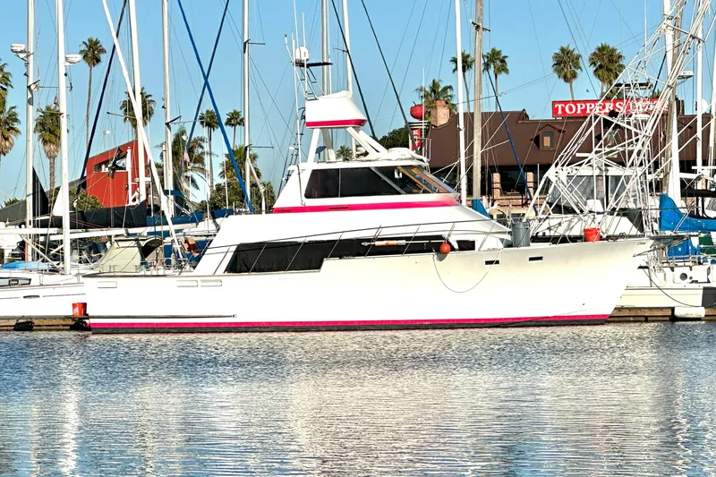 The Image of 1973 Elliott Yachtfisher docked at marina during sunset, featuring sleek design and vibrant accents. - 0