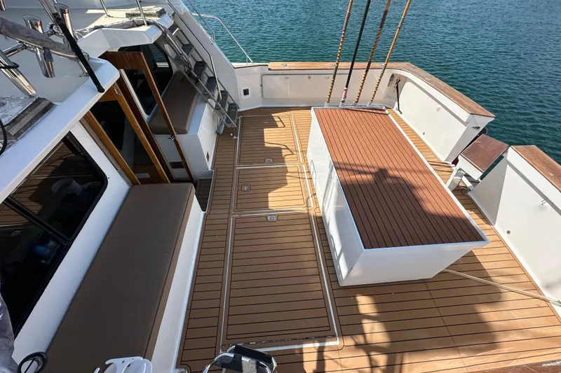 Slide: The Image of 1973 Elliott Yachtfisher helm with navigation equipment and marina view. - 21