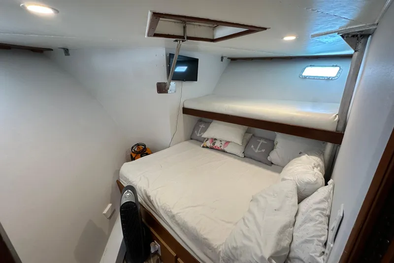 Slide: The Image of Interior of a 1973 Elliott Yachtfisher with cozy seating and nautical decor. - 26