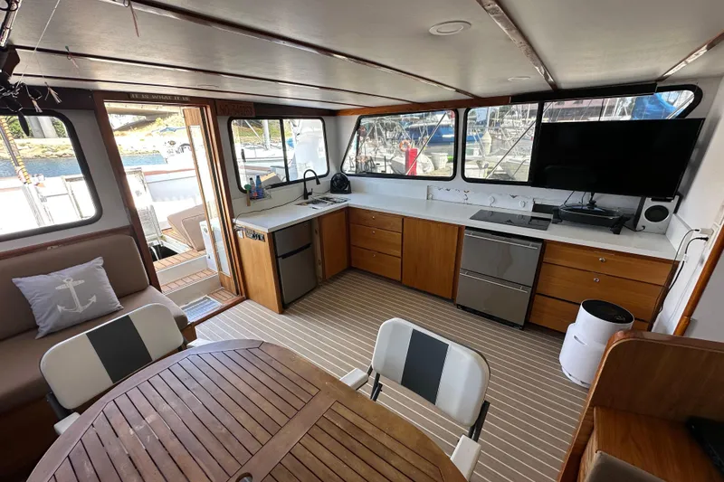 Slide: The Image of Cozy cabin interior of 1973 Elliott Yachtfisher with bunk beds and nautical-themed pillows. - 28