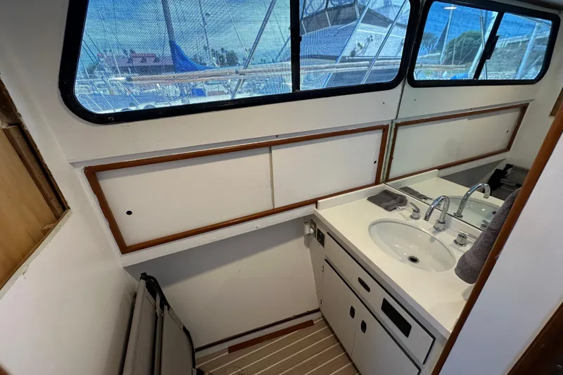 Slide: The Image of Interior of a 1973 Elliott Yachtfisher with modern kitchen and dining area. - 30
