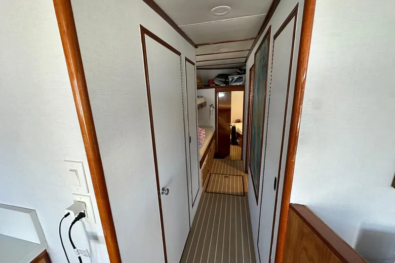 Slide: The Image of Interior of 1973 Elliott Yachtfisher with seating, table, and large windows overlooking marina. - 33