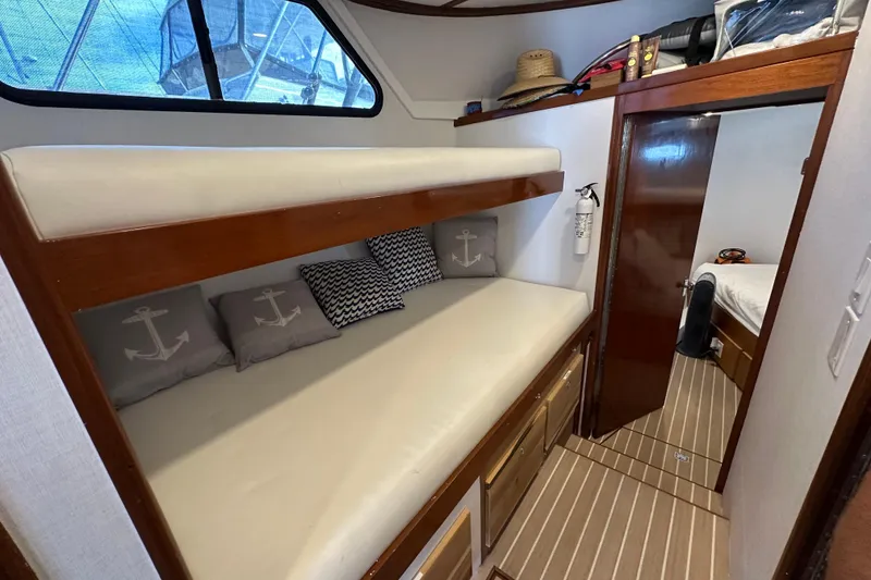 Slide: The Image of Hallway inside 1973 Elliott Yachtfisher, featuring a nautical map and wooden accents. - 37