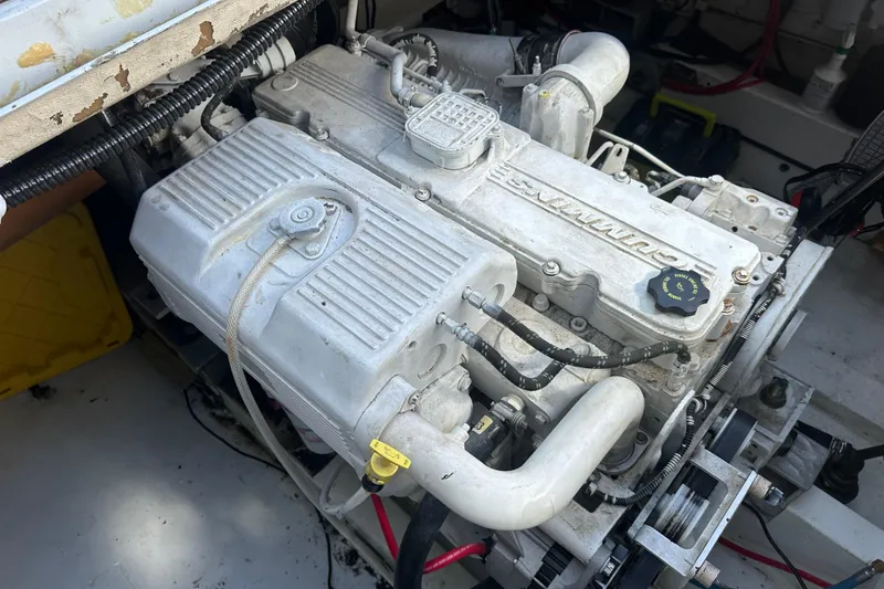 Slide: The Image of 1973 Elliott Yachtfisher interior with cozy bunk beds and nautical-themed pillows. - 39