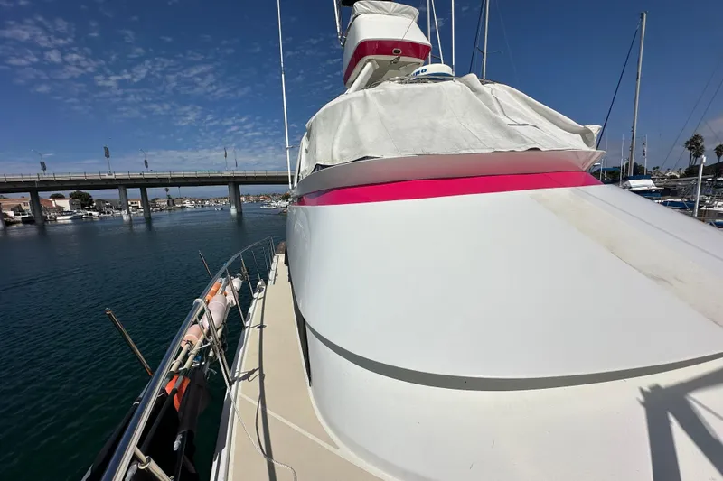 Slide: The Image of 1973 Elliott Yachtfisher docked at marina under clear blue sky. - 4