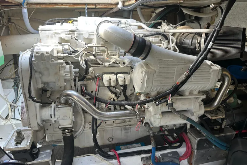 Slide: The Image of Engine of a 1973 Elliott Yachtfisher, showcasing intricate mechanical components and wiring. - 43