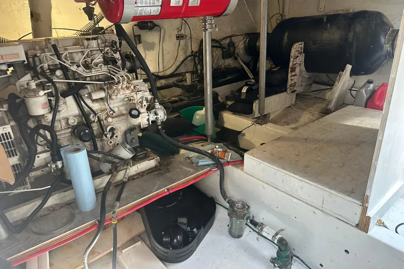 Slide: The Image of Engine room of a 1973 Elliott Yachtfisher, showcasing mechanical components and equipment. - 44