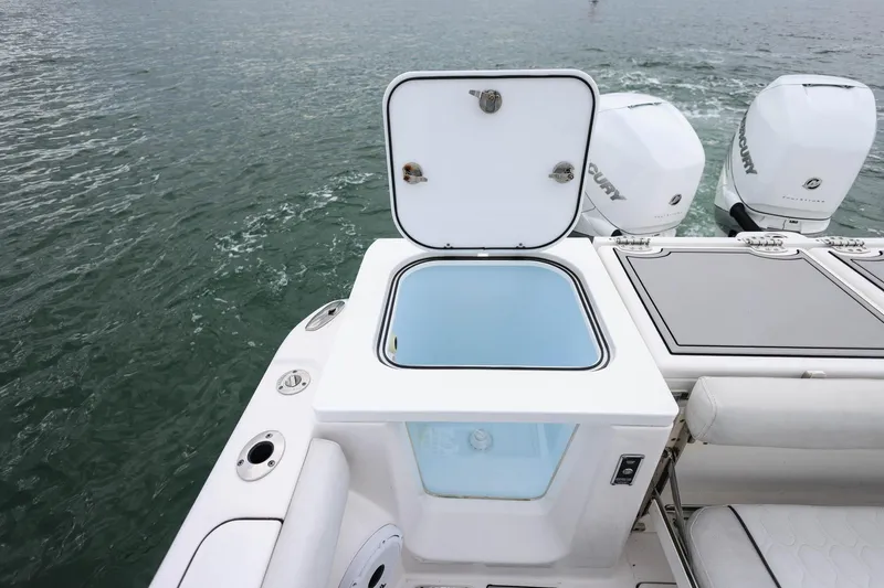 Slide: The Image of 2022 Sea Fox 368 Commander boat with open storage compartment and Mercury engines. - 12