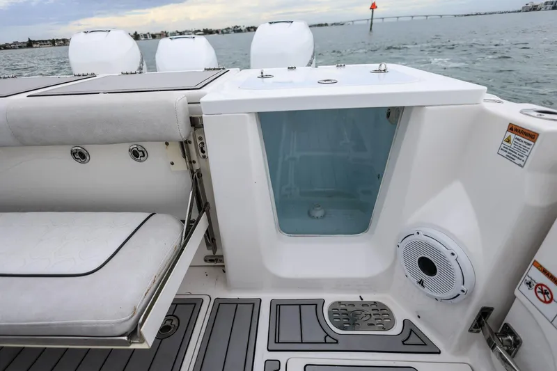Slide: The Image of 2022 Sea Fox 368 Commander boat interior with seating, storage, and speaker. - 13