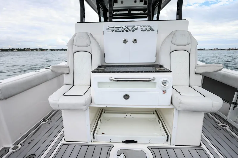 Slide: The Image of 2022 Sea Fox 368 Commander boat interior with seating and storage on the water. - 15