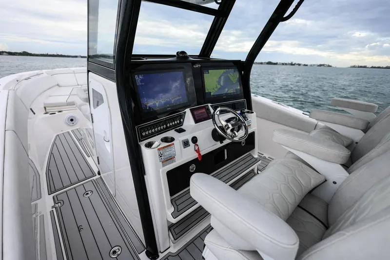 Slide: The Image of 2022 Sea Fox 368 Commander boat cockpit with advanced navigation displays and luxurious seating. - 17