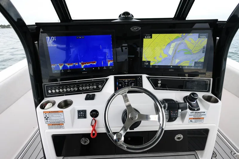 Slide: The Image of 2022 Sea Fox 368 Commander helm with dual Garmin displays and modern controls. - 19
