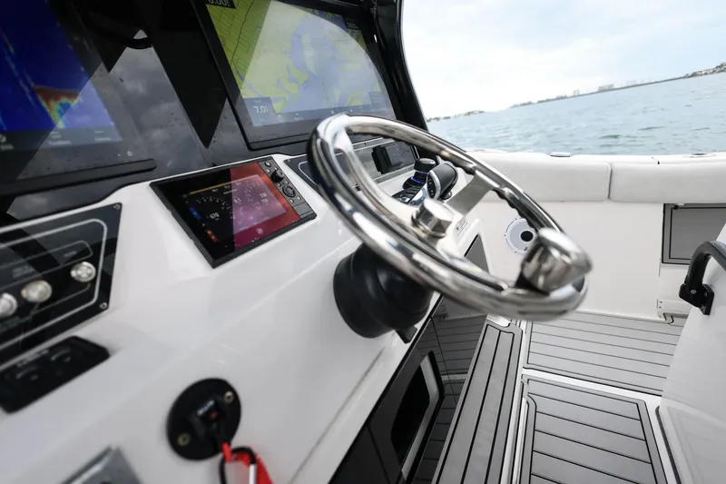 Slide: The Image of 2022 Sea Fox 368 Commander helm with advanced navigation displays and sleek steering wheel. - 20