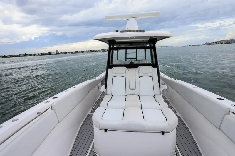 Slide: The Image of 2022 Sea Fox 368 Commander boat with luxurious seating on calm waters. - 27