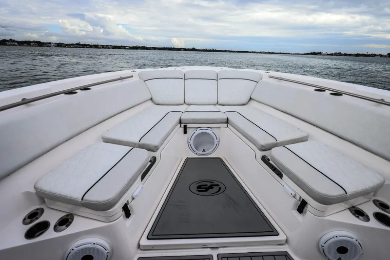 Slide: The Image of 2022 Sea Fox 368 Commander boat interior with cushioned seating and ocean view. - 29
