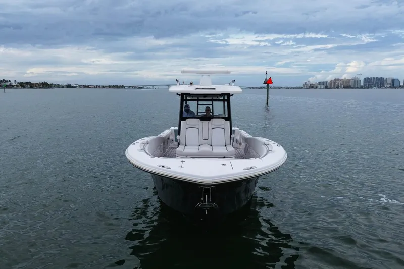 Slide: The Image of 2022 Sea Fox 368 Commander boat on calm water under cloudy sky. - 3
