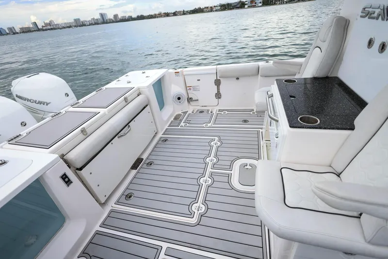 Slide: The Image of 2022 Sea Fox 368 Commander boat interior with seating, storage, and Mercury engines. - 38